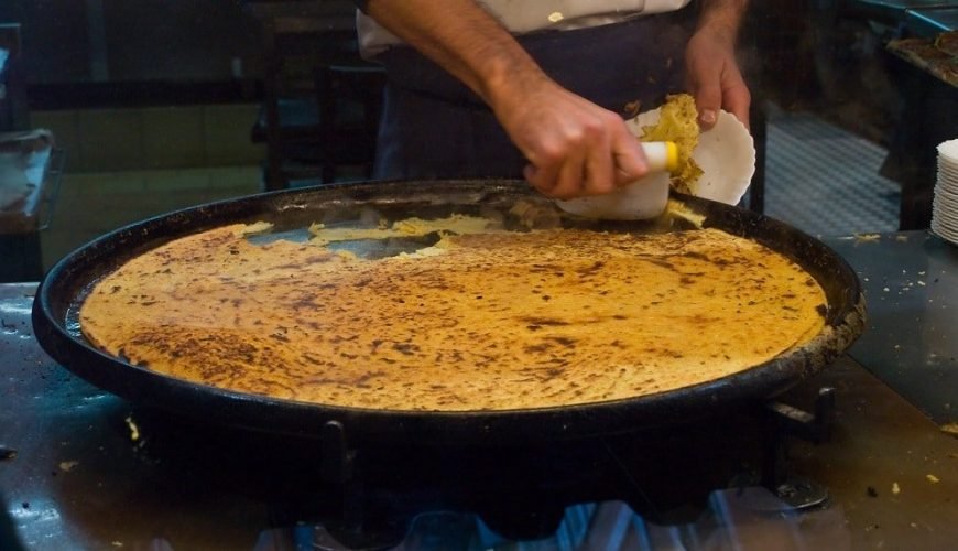 History and recipe of the Socca
